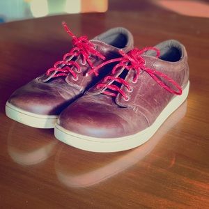 LL Bean leather sneakers with red paracord laces.